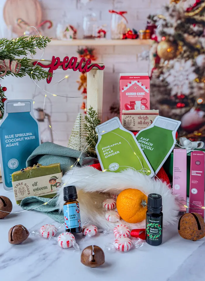 A festive arrangement of wellness products, peppermints and holiday decor