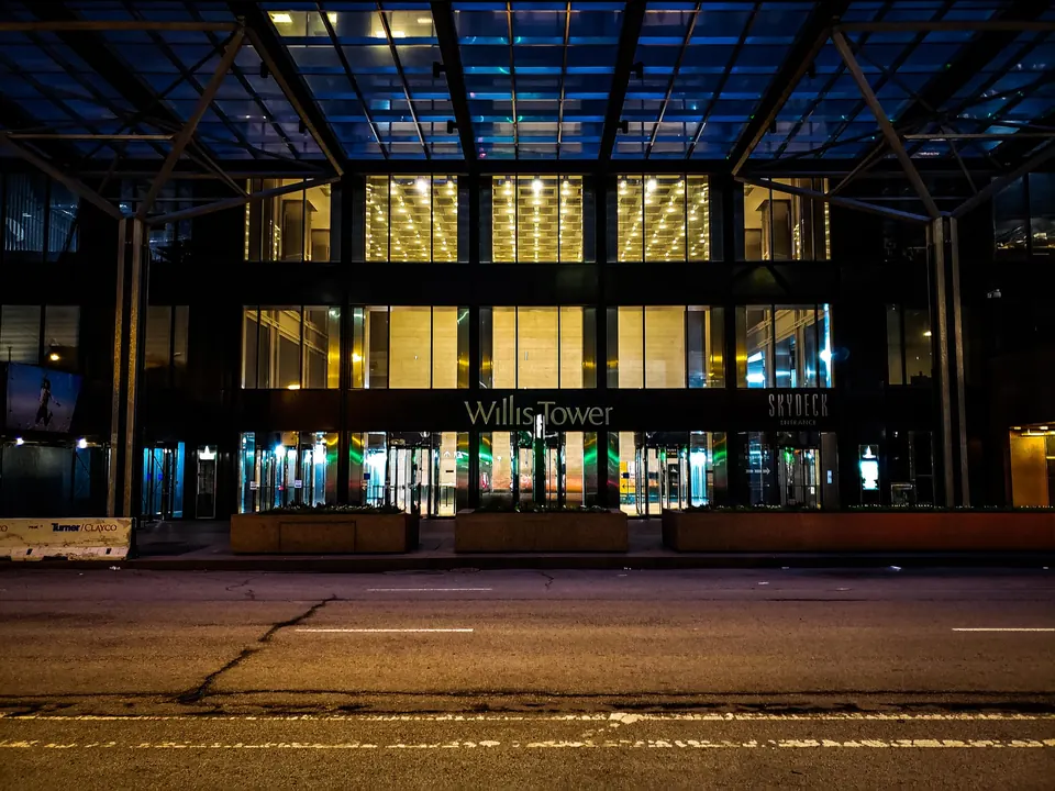 The entrance to Willis Tower lit up at night
